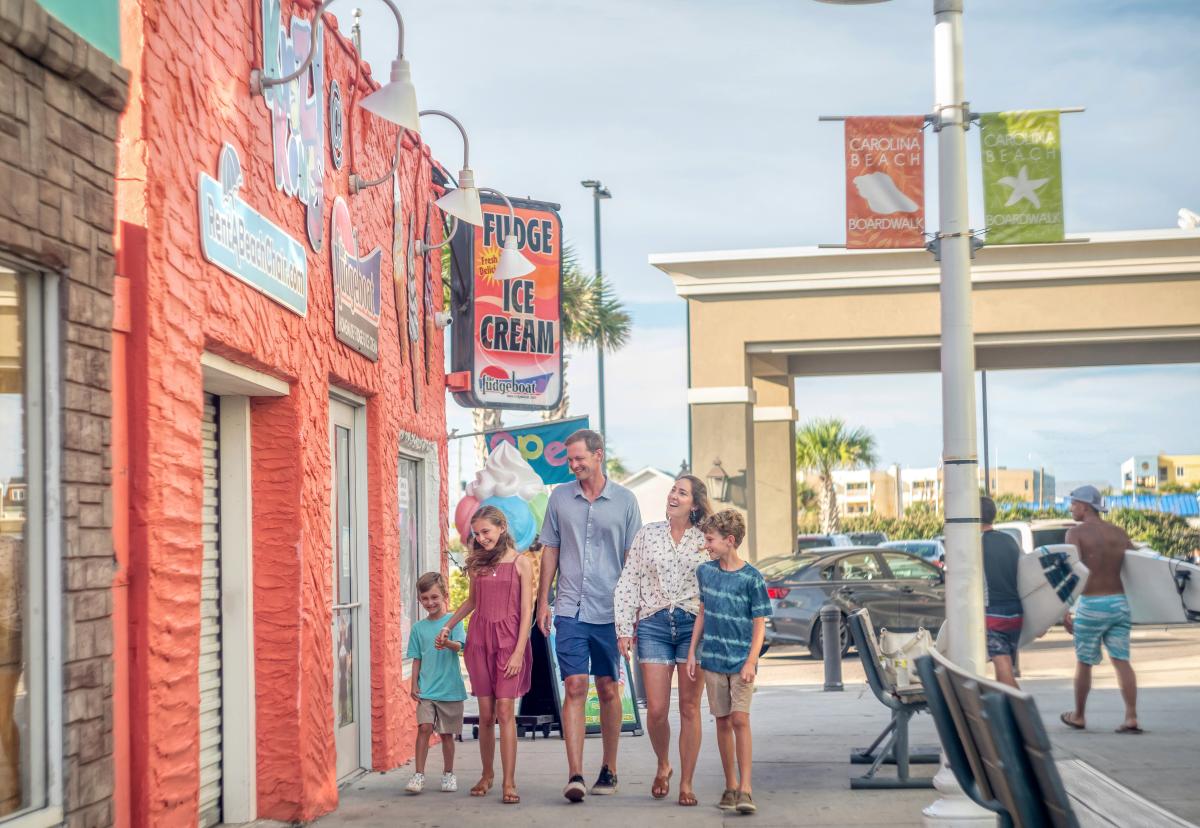 Family walking along the Carolina Beach Boardwalk