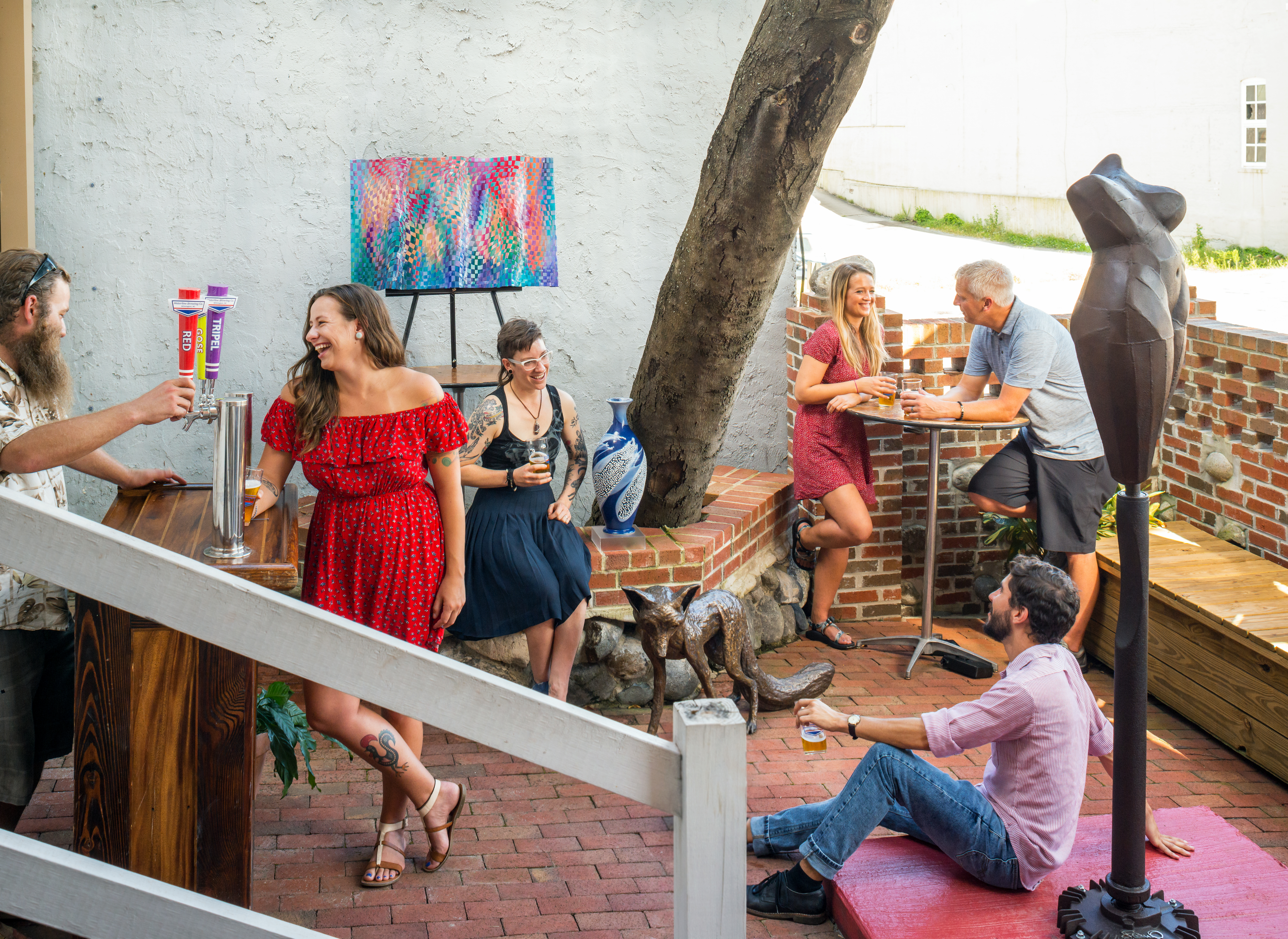 Art in Bloom Gallery visitors enjoying the outdoor courtyard space