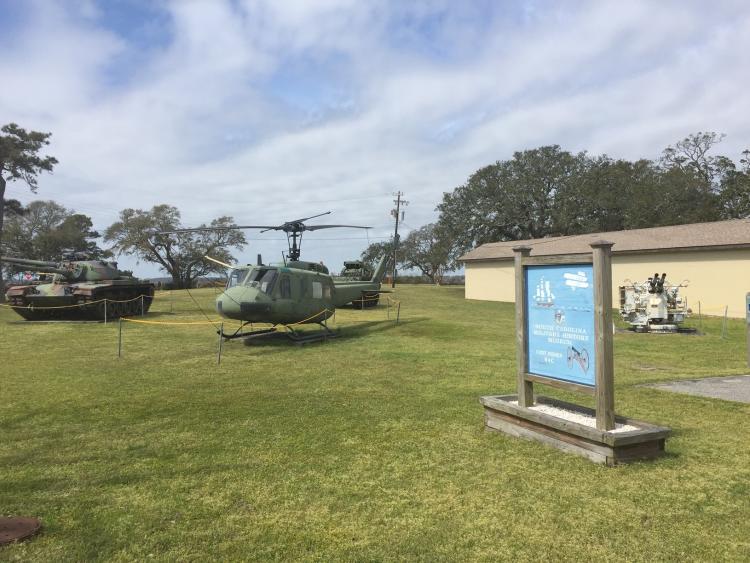 A tank, helicopter and anti-air gun at the NC Military Museum in Kure Beach