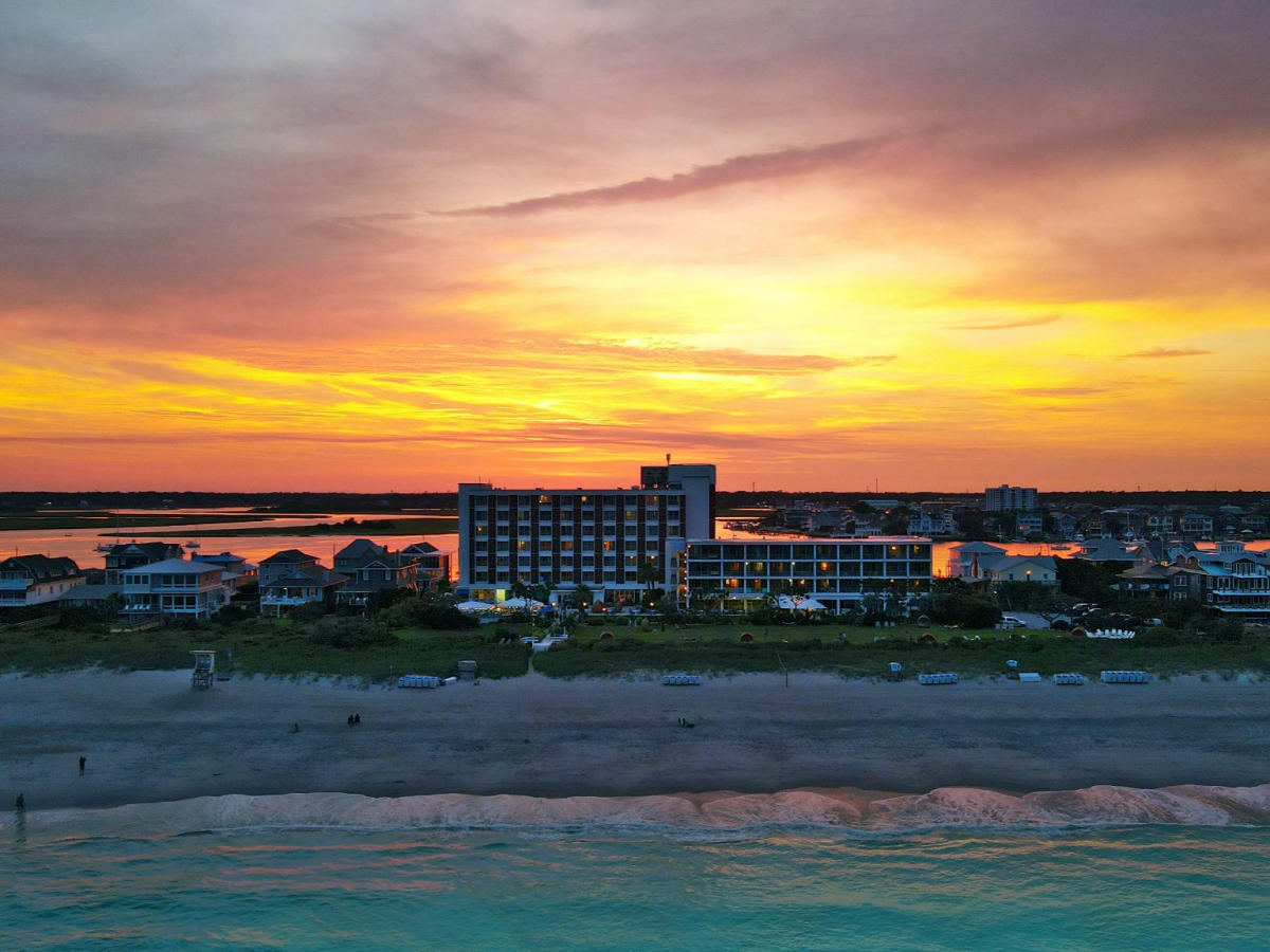 Drone image over the ocean facing Blockade Runner Beach Resort.