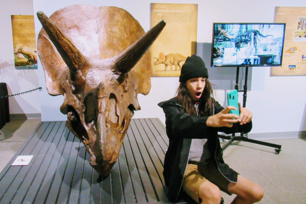 Selife with the dino exhibit at Cape Fear Museum