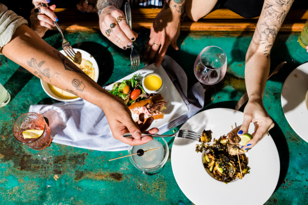 Group of friends enjoying food at Feast Wilmington event